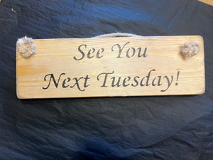 Wooden sign See You Next Tuesday