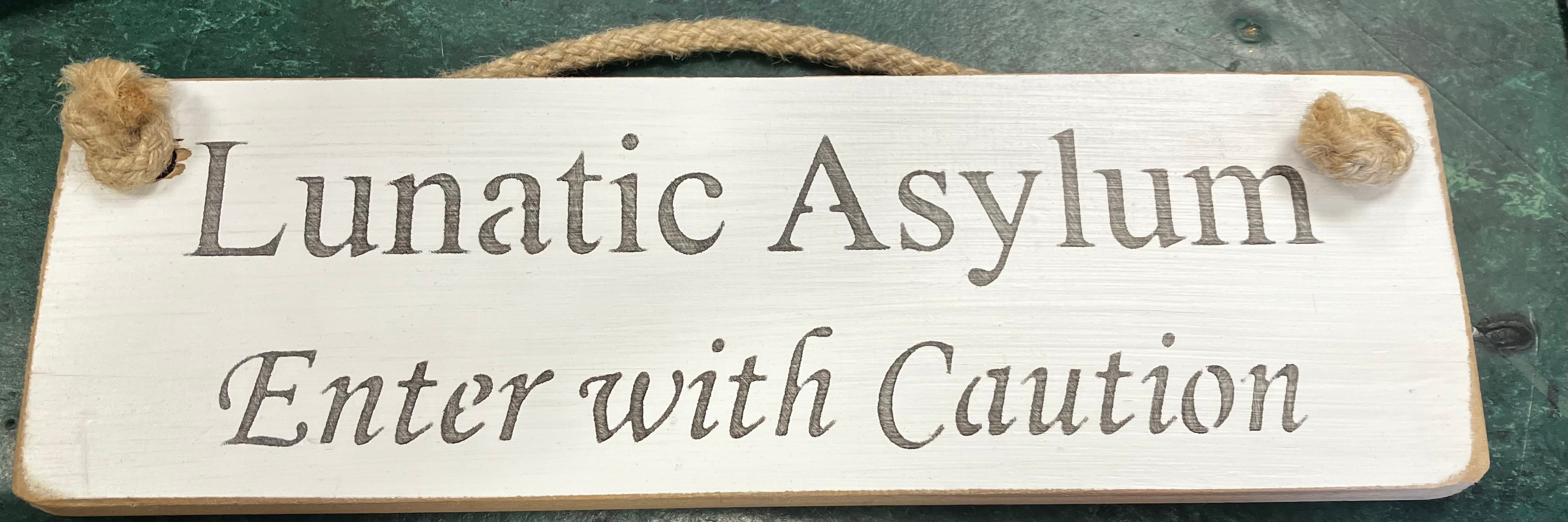 Wooden sign lunatic asylum