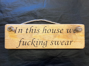 Wooden sign swearing house