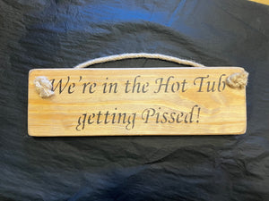 Wooden sign hot tub swearing