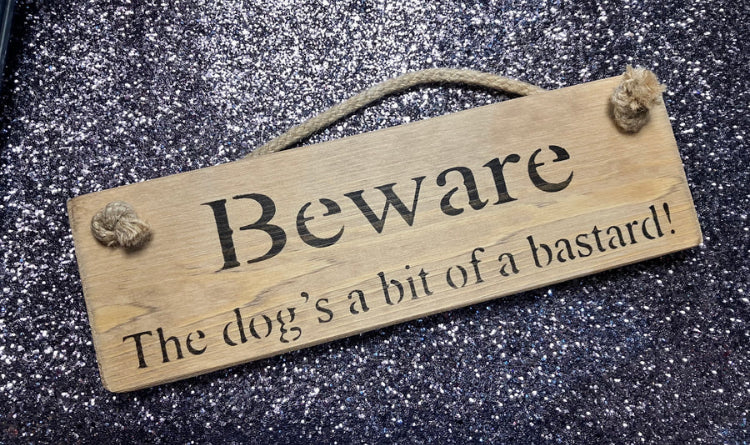 Wooden sign beware of dog