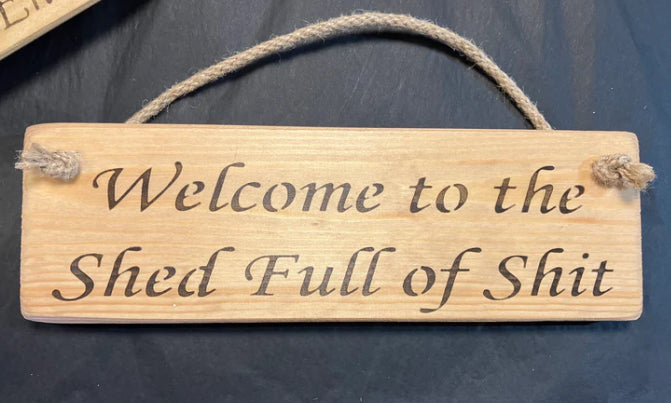 Wooden sign shed of shit