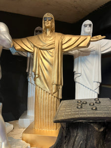 Gold Christ the Redeemer wearing sunglasses