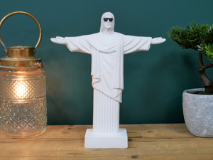 White Christ the Redeemer wearing sunglasses