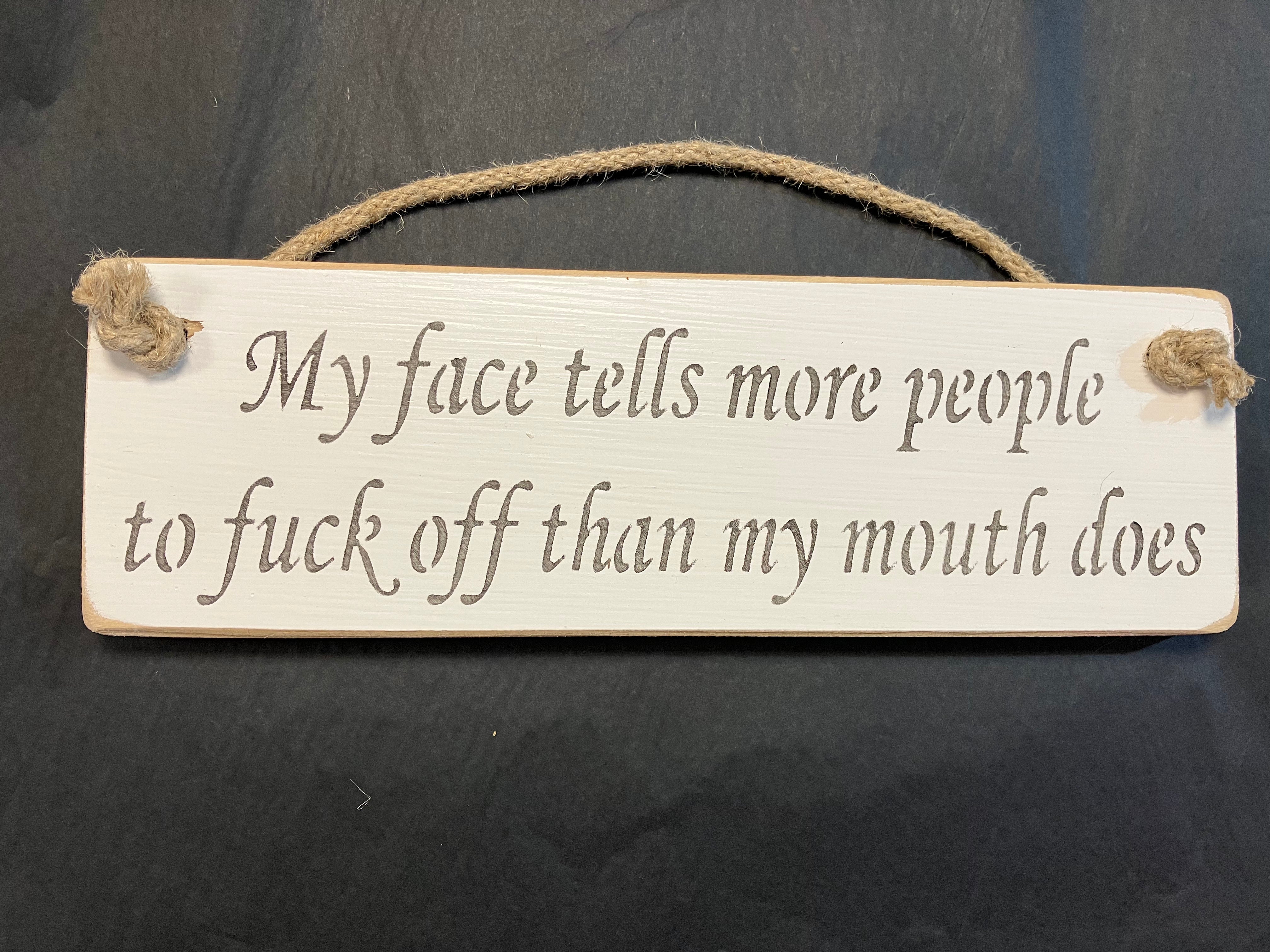 My face tells more people to fuck off than my mouth does wooden roped sign