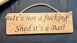 It’s not a fucking shed it’s a bar wooden roped sign
