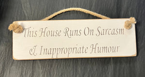 Solid Wood Handmade Roped Sign - This house runs on sarcasm