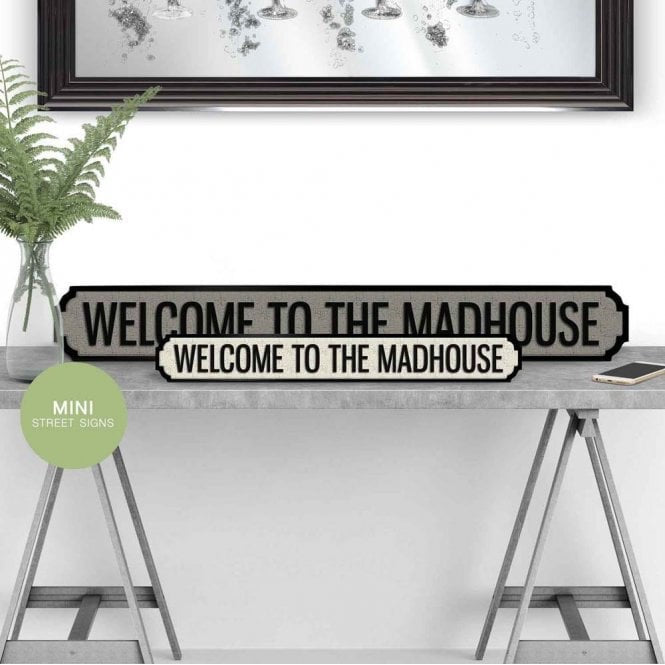 welcome to the madhouse street sign